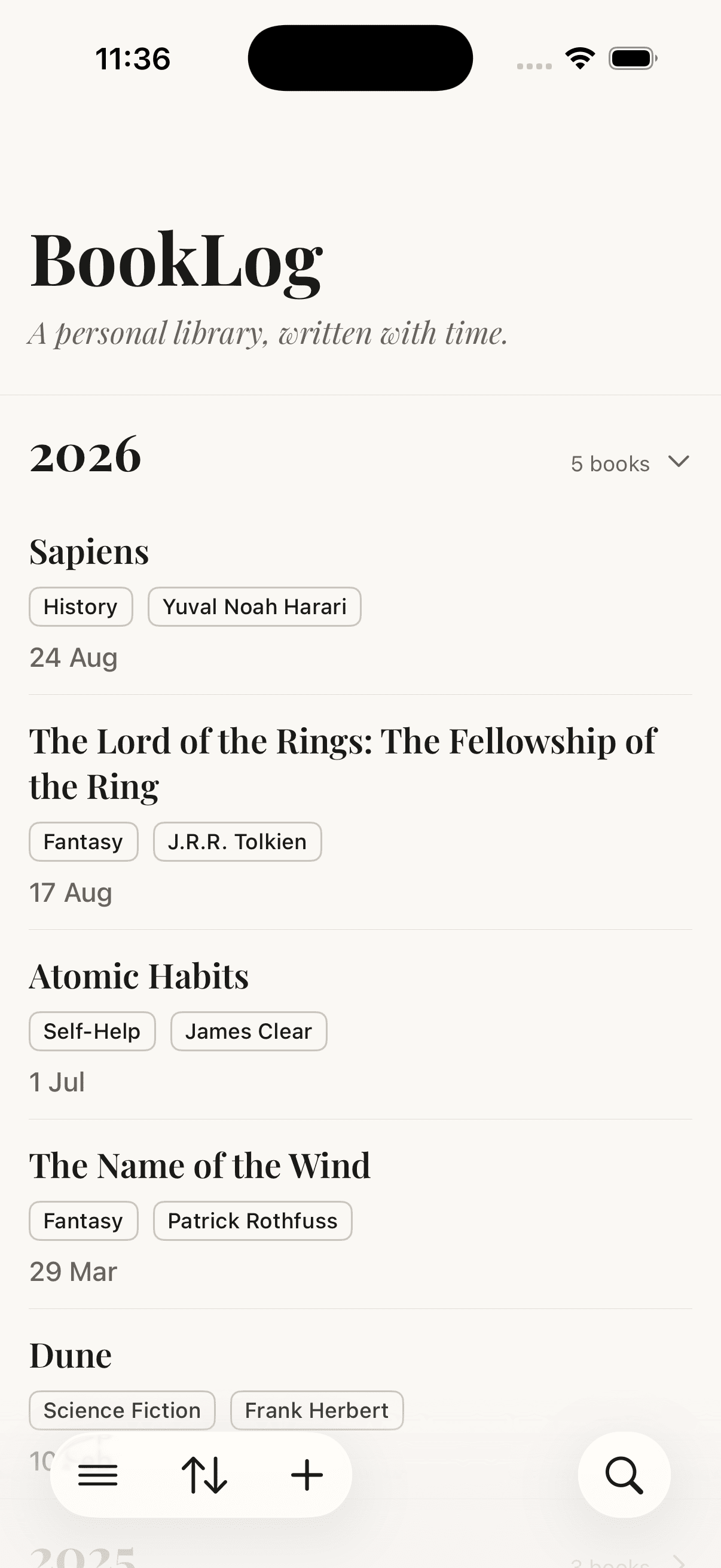 BookLog library view, books grouped by reading year, with the bottom navigation bar visible